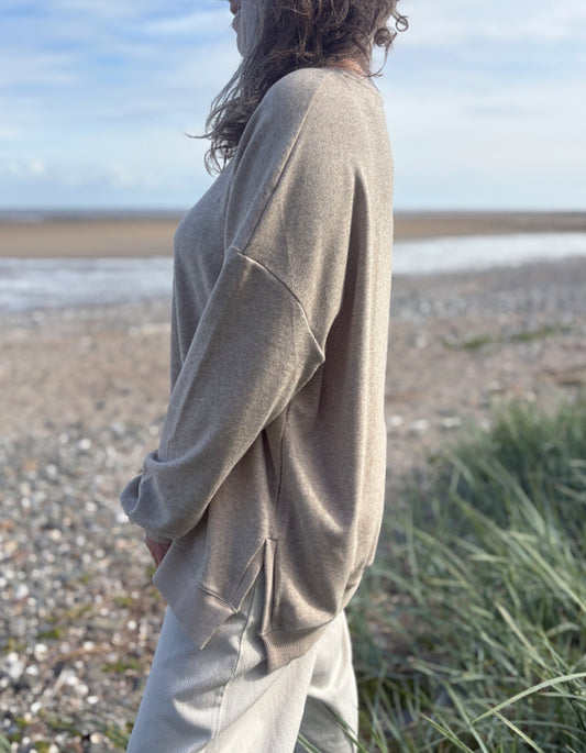 beige oversized sweatshirt and cotton cream trousers