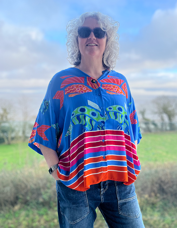 oversized viscose summer shirt with elbow length sleeves and simple round collar with hot colours and an abstract fish print