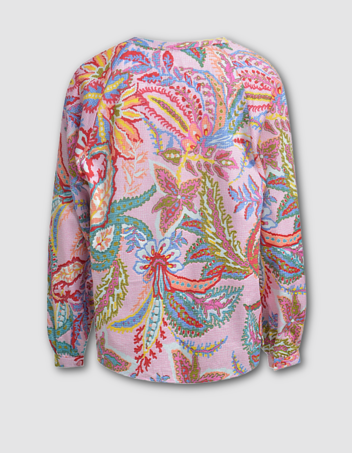 Colorful floral patterned shirt on a light gray background