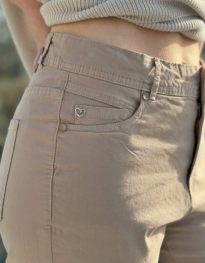 sandy coloured neutral cotton straight leg trouser with 5 pockets and button fly closure