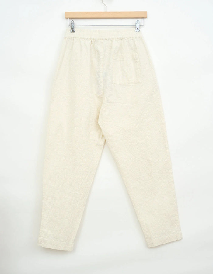 cream seersucker tapered leg trousers with elasticated waist