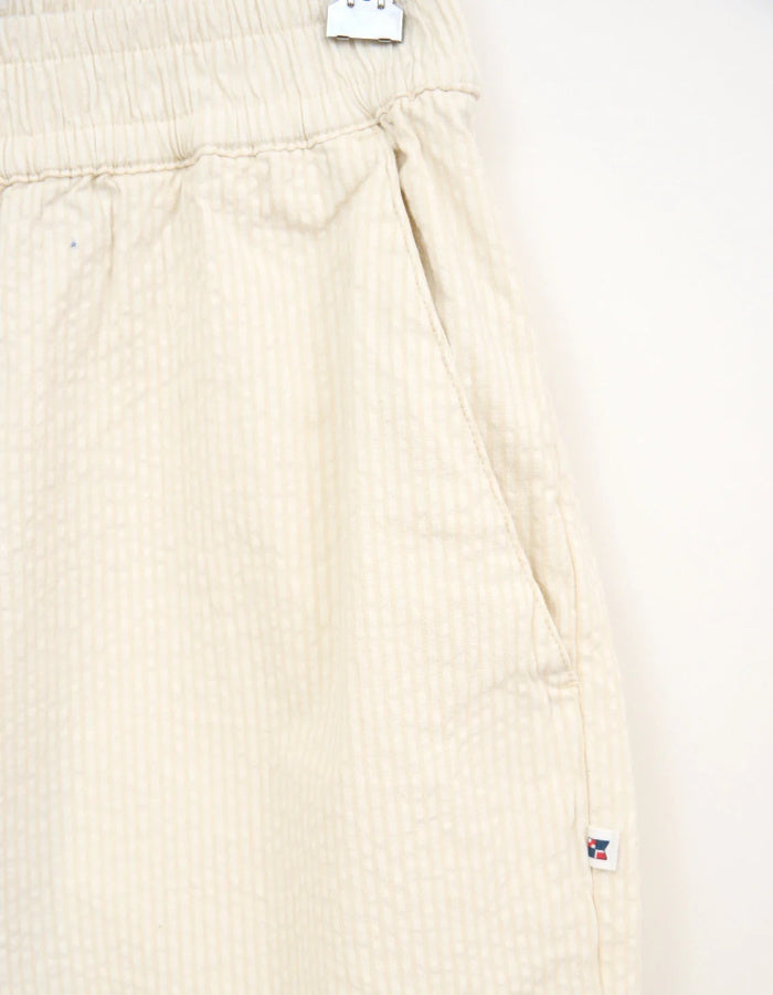 cream seersucker tapered leg trousers with elasticated waist