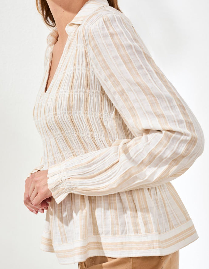 Striped blouse with long sleeves on a white background