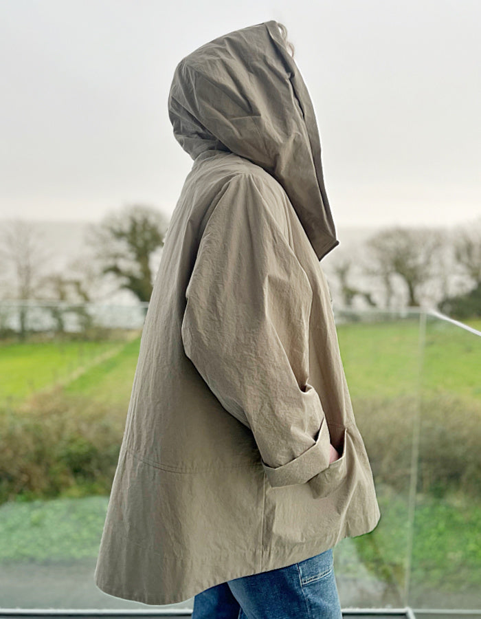 camel cotton coat with shawl collar and hood with asymmetrical front zip