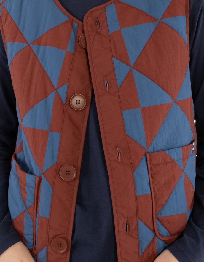 Geometric patterned vest with brown and blue triangles