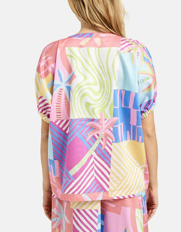 oversized cotton blouse with tropical print inn pastel bright shade