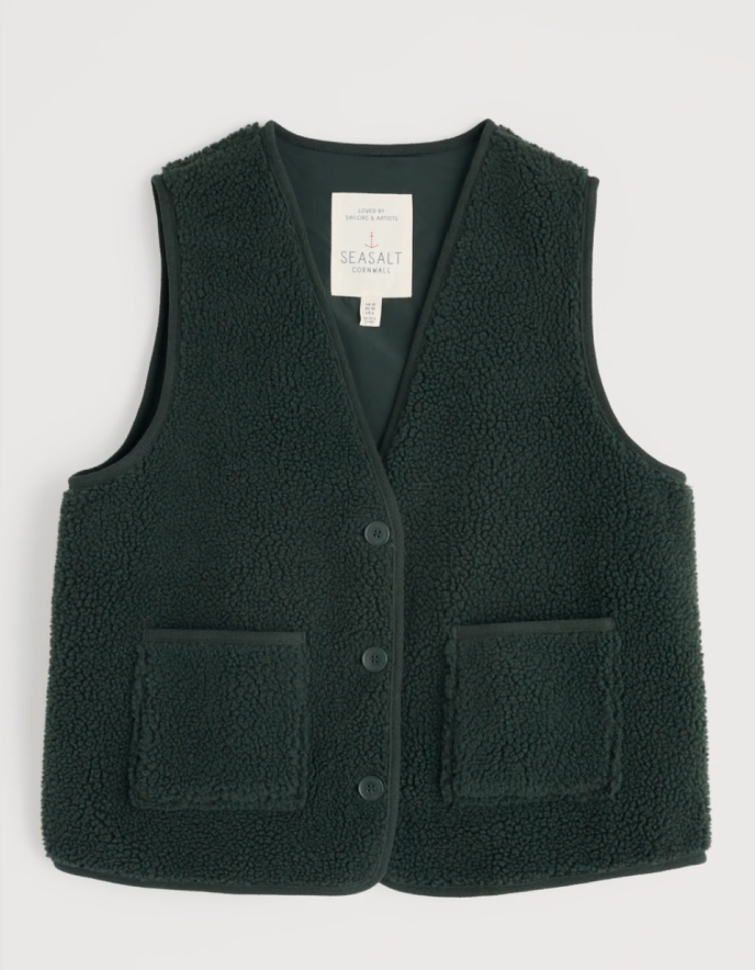 Dark green fleece vest with two front pockets on a light gray background