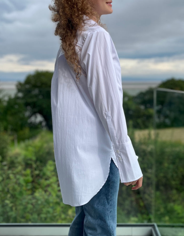long length white shirt, classic oxford style with collar and buttons with turn back cuffs.