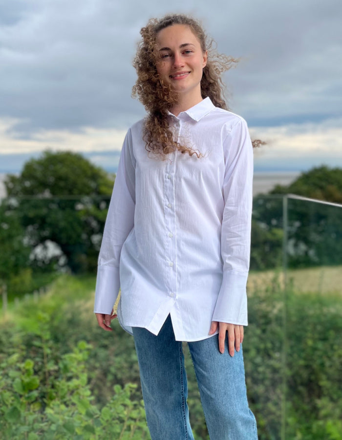 long length white shirt, classic oxford style with collar and buttons with turn back cuffs.