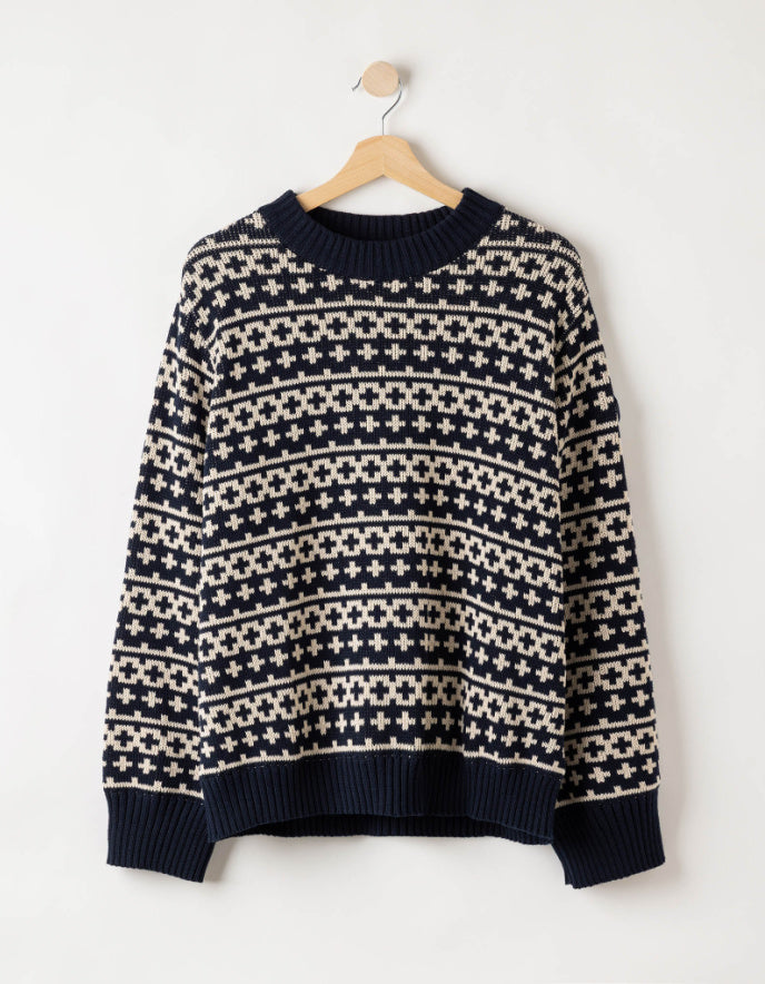 woman wearing navy and white windproof crew sweater