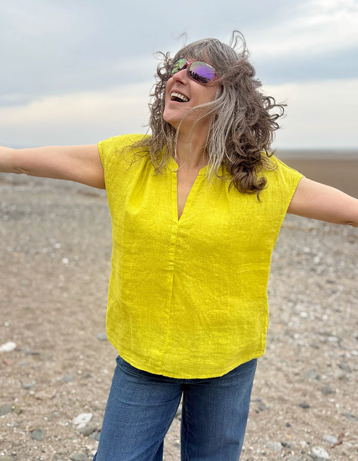 yellow linen v neck top with capped sleeves