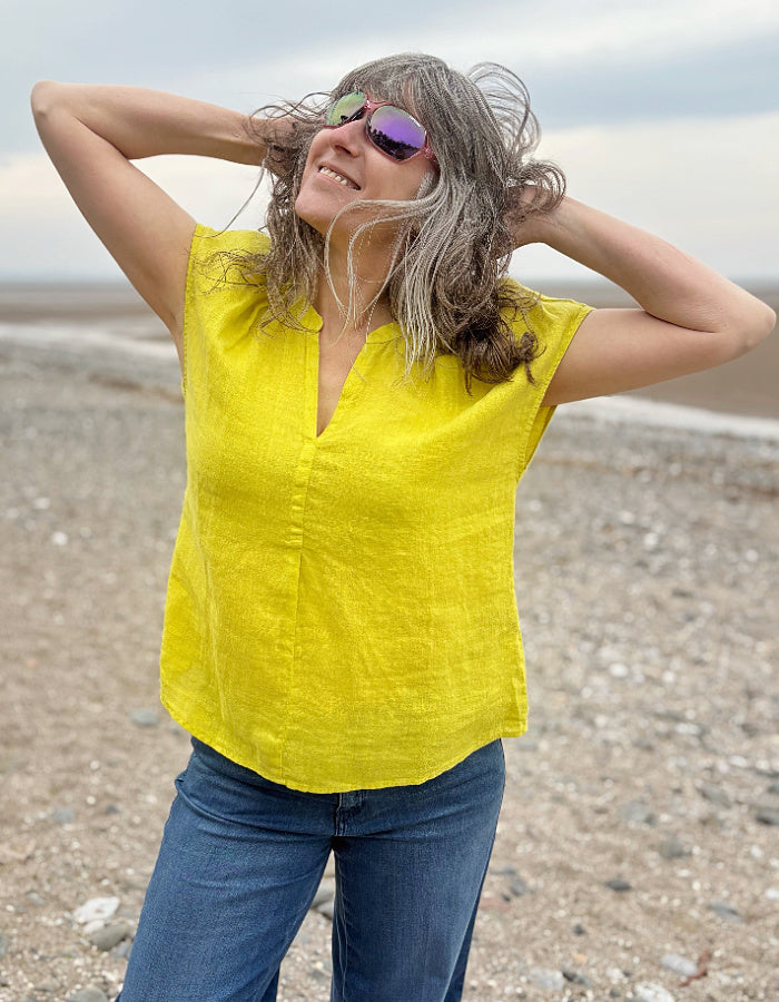 yellow linen v neck top with capped sleeves