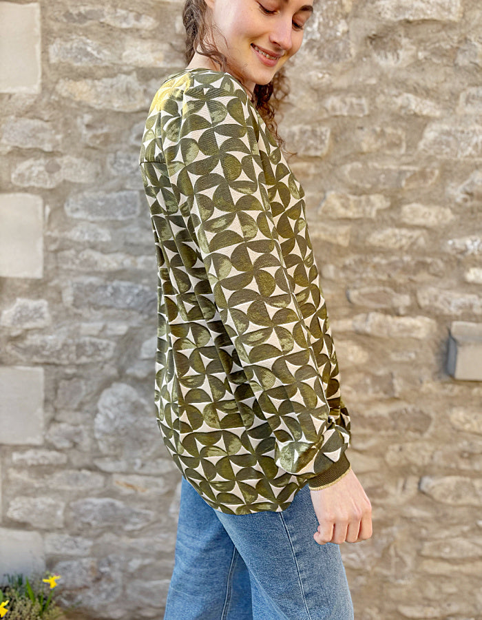 jersey tunic top with v neckline and elasticated cuffs, graphic print in sand and olive green