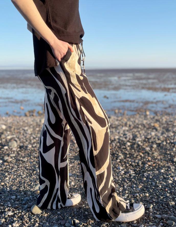 woman wearing zebra print wide leg trousers