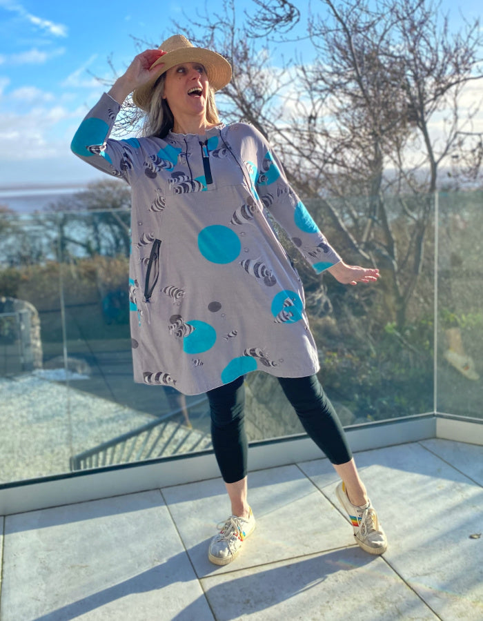 grey cotton stretch jersey tunic with turquoise fish print and half zip, two pockets with zip closure