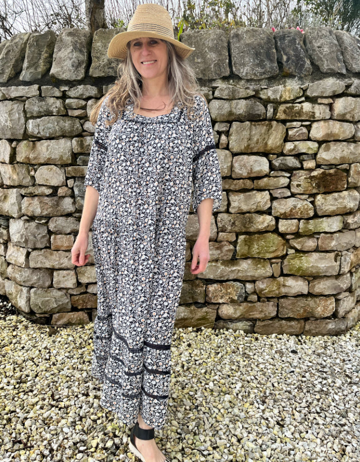 black and white floral maxi dress with tiered skirt, square neckline and boho sleeves