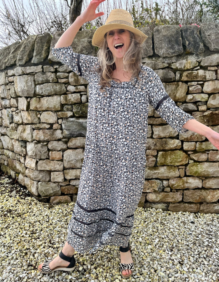 black and white floral maxi dress with tiered skirt, square neckline and boho sleeves