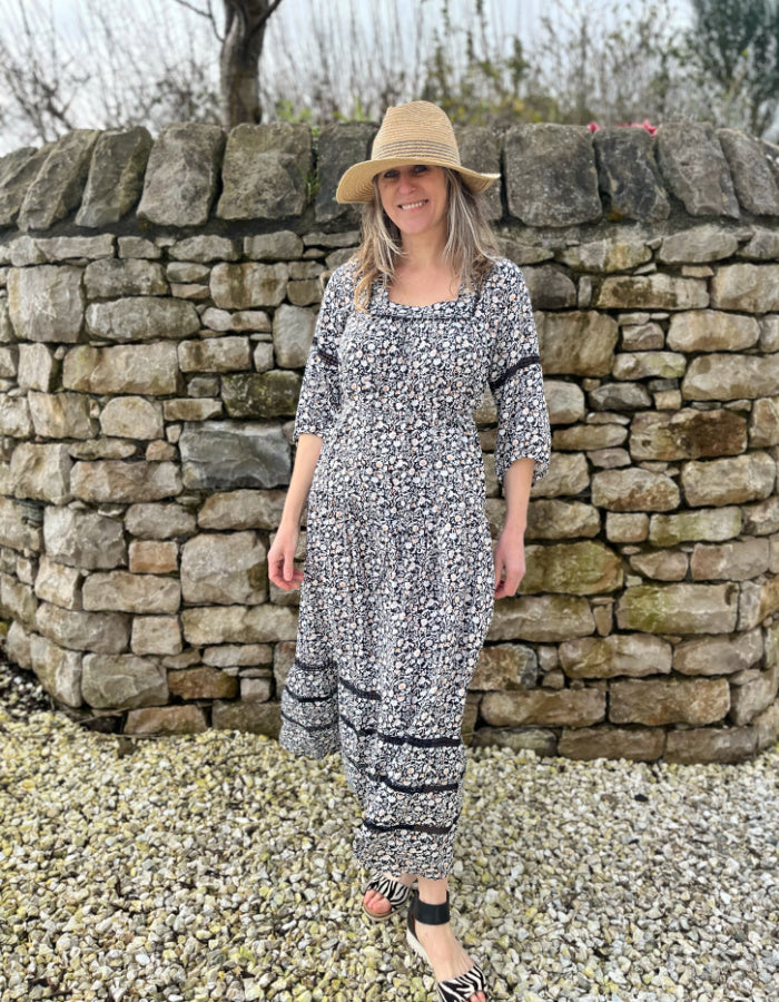 black and white floral maxi dress with tiered skirt, square neckline and boho sleeves