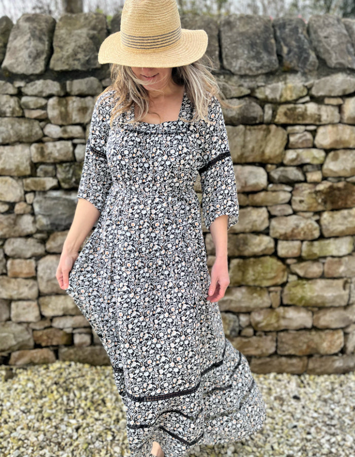 black and white floral maxi dress with tiered skirt, square neckline and boho sleeves