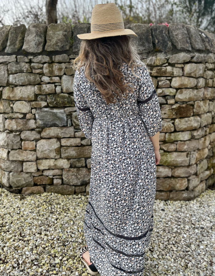 black and white floral maxi dress with tiered skirt, square neckline and boho sleeves