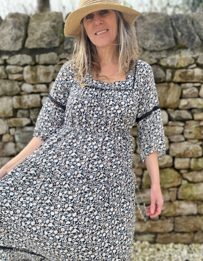 black and white floral maxi dress with tiered skirt, square neckline and boho sleeves