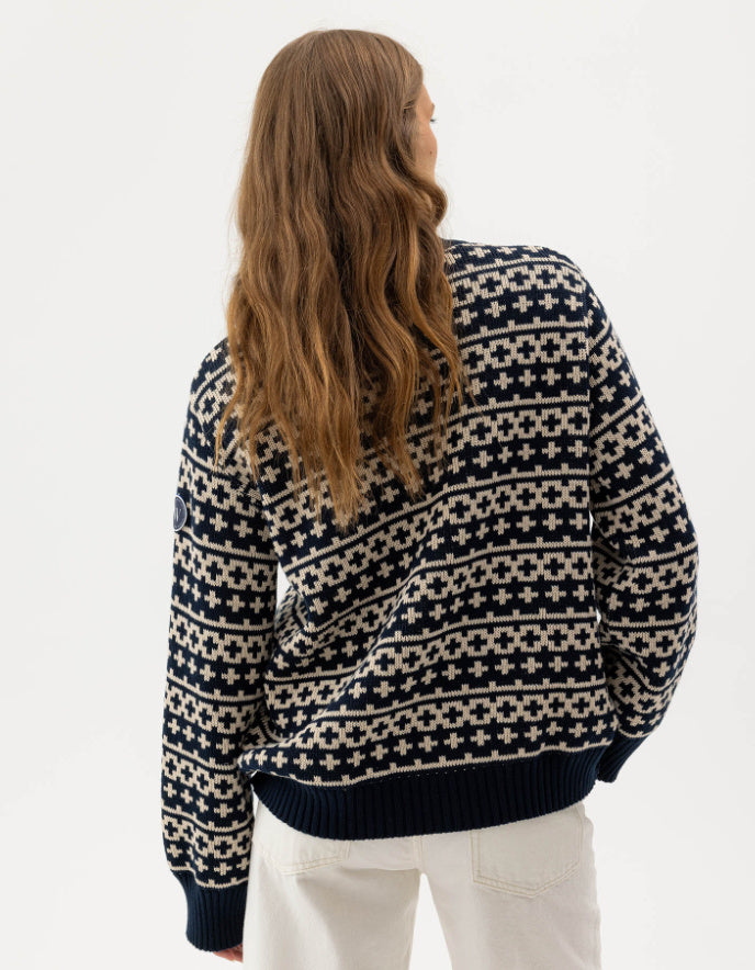 woman wearing navy and white windproof crew sweater