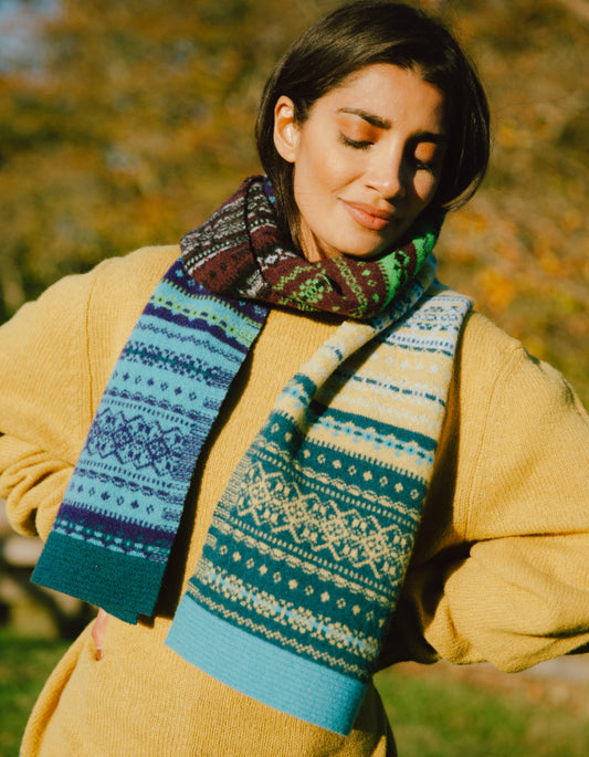 woman wearing fair isle autumn toned wool scarf