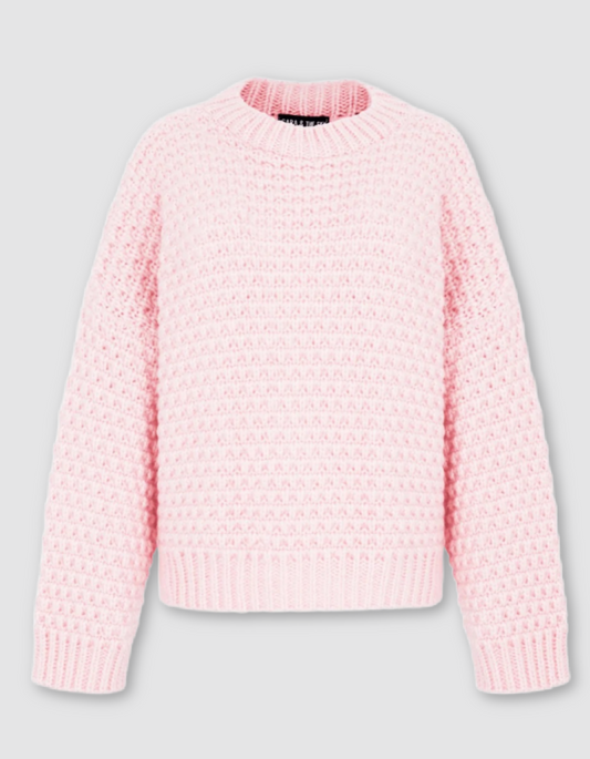 A light pink textured knit sweater with a crew neck, shown against a neutral light gray background.