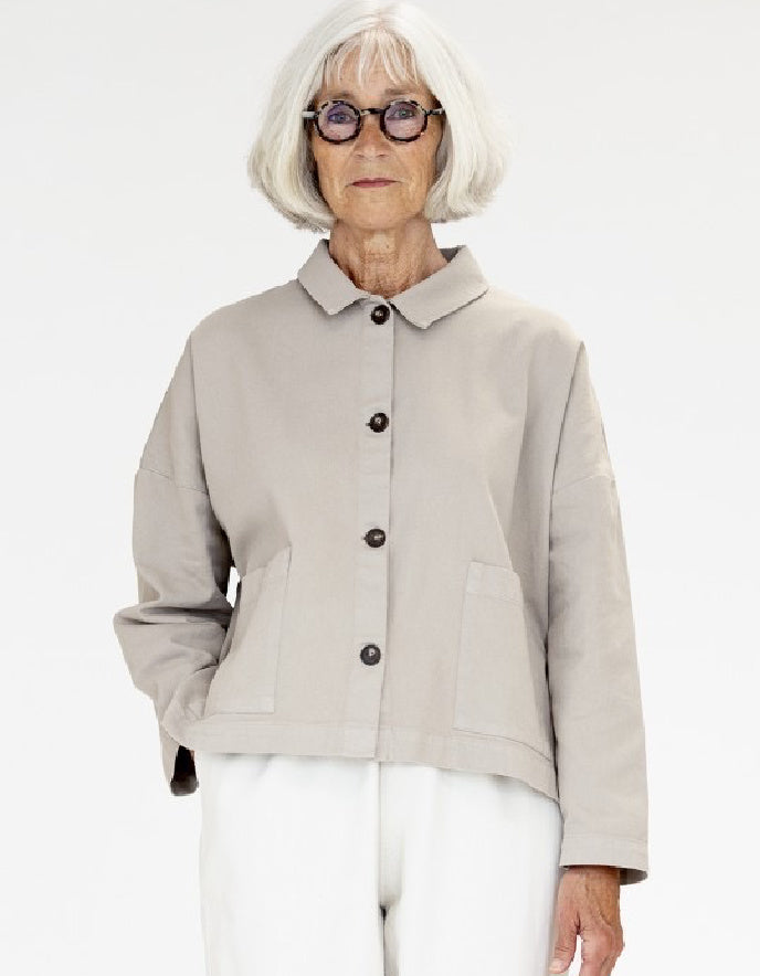 woman wearing a camel cotton canvas workwear inspired  jacket