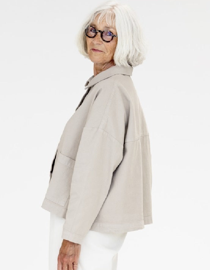 woman wearing a camel cotton canvas workwear inspired  jacket