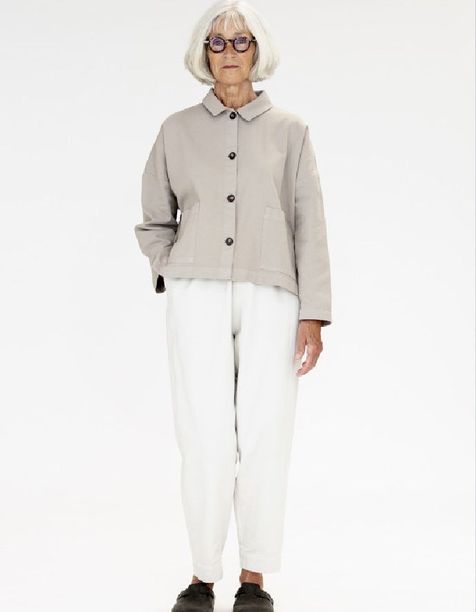 woman wearing a camel cotton canvas workwear inspired  jacket