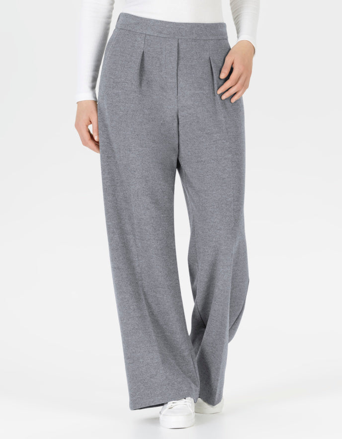 Grey wide-leg pants worn by a person on a white background