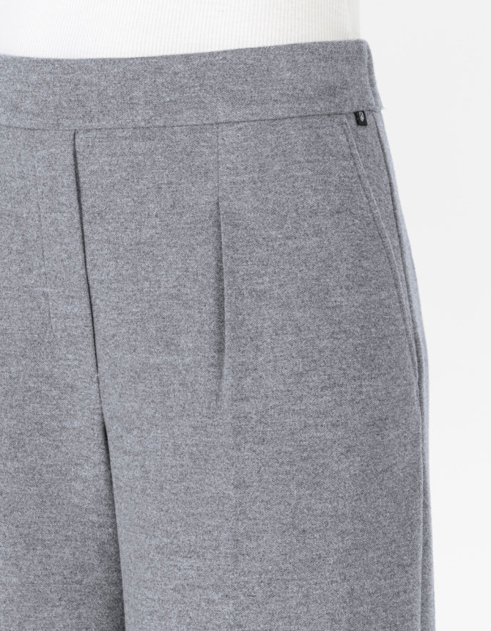 Close-up of gray pants with a white background