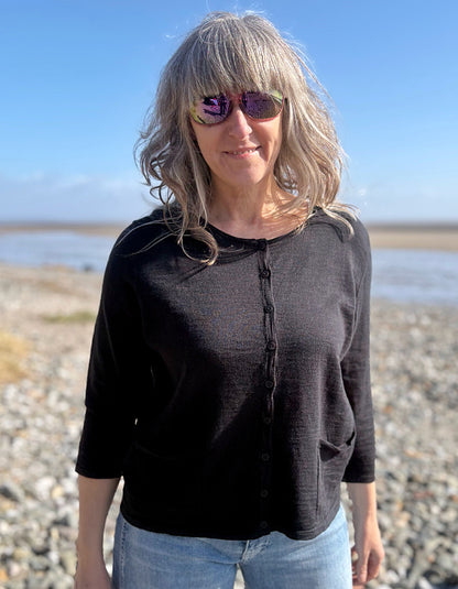 woman wearing a black cotton cardigan