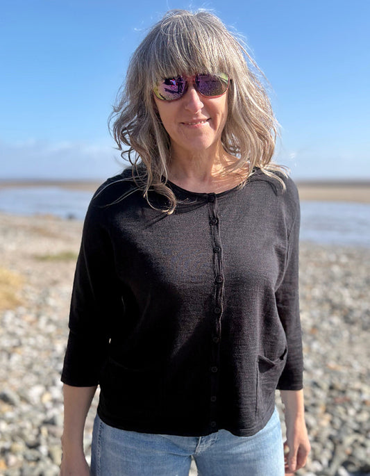 woman wearing a black cotton cardigan