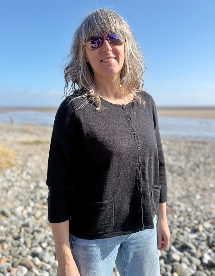 woman wearing a black cotton cardigan