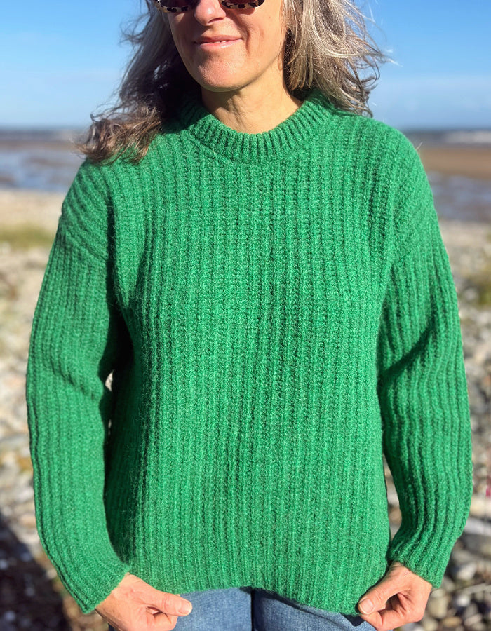 green ribbed wool sweater