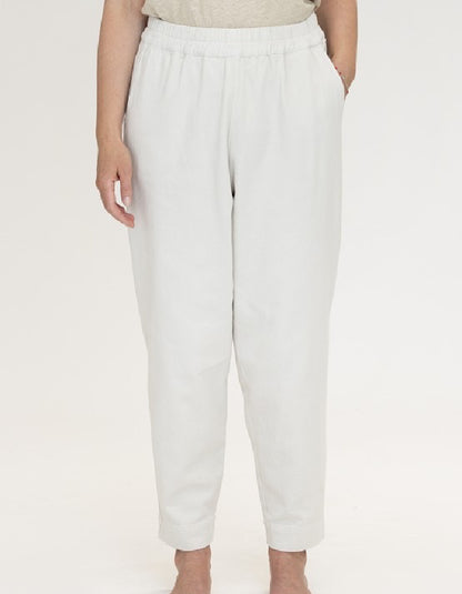 woman wearing natural coloured cotton canvas trousers with elasticated waist