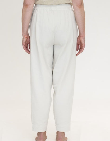 woman wearing natural coloured cotton canvas trousers with elasticated waist