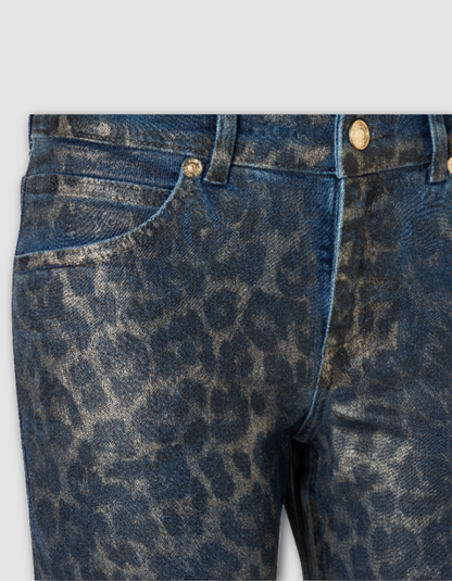 Close-up of blue jeans with a subtle pattern on a light gray background