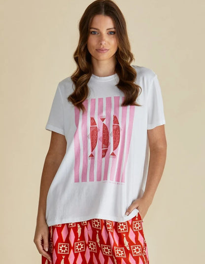 Woman wearing a white t-shirt with a pink graphic design on a beige background