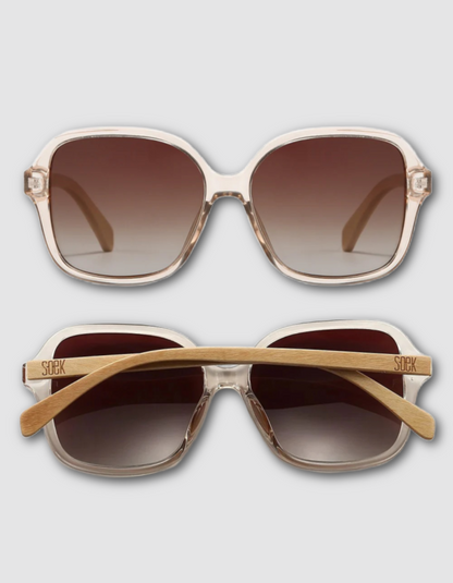 Two views of square sunglasses with a translucent off-white frame, brown gradient lenses, and light wood temples. The top view shows the front, and the bottom view shows the side with 'Soek' branding on the temple arm, set against a light grey background.