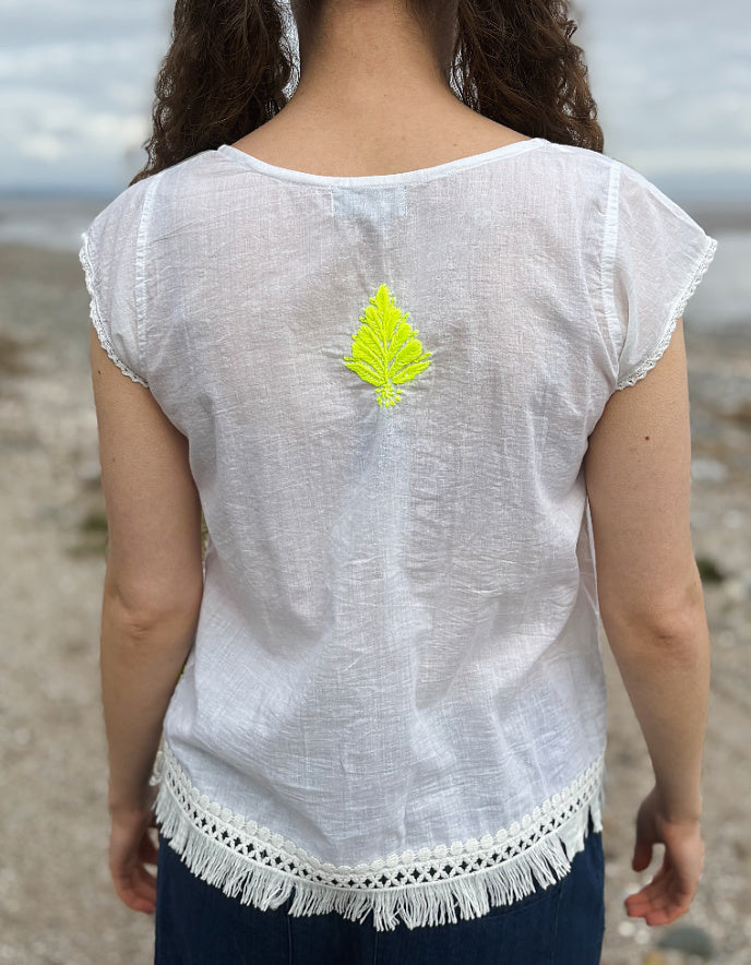 white cotton embroidered top with yellow detail