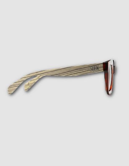 Wood grain patterned acetate sunglasses arms with a silver metal hinge and reddish-brown temple tip, shown against a light gray background.