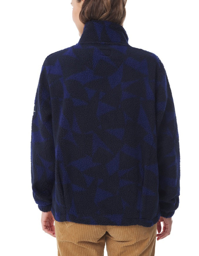 Person wearing a blue patterned jacket on a white background