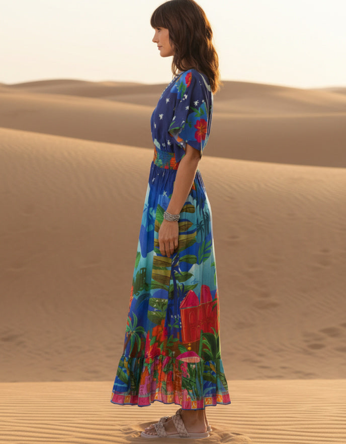 woman wearing a shirred waisted maxi dress with arabian nights print