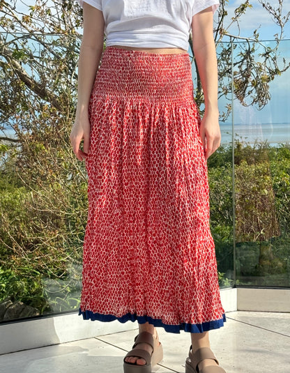 one size skirt with high smocked waist that can also be worn as a dress in tulip red hand blocked print