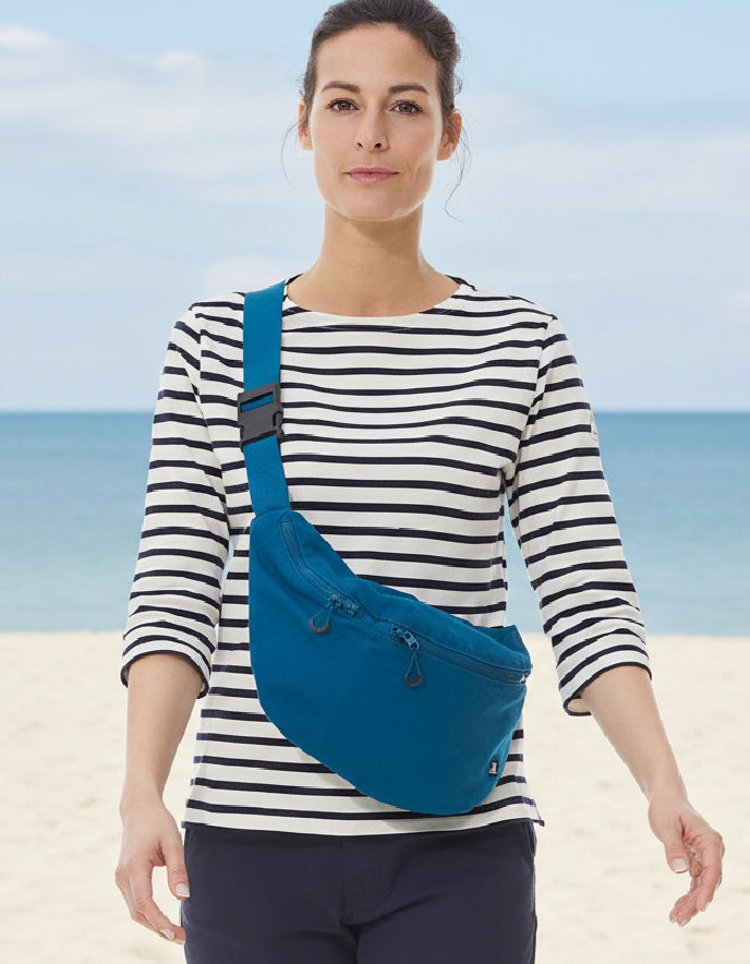 woman wearing teal cotton canvas  crossbody bag 