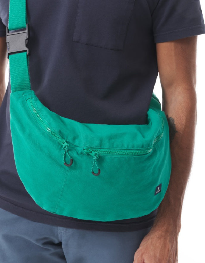 man wearing jade cotton canvas green crossbody bag 