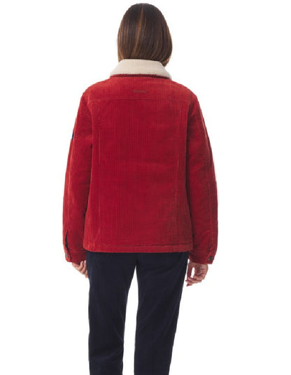 Red corduroy jacket worn by a person on a white background
